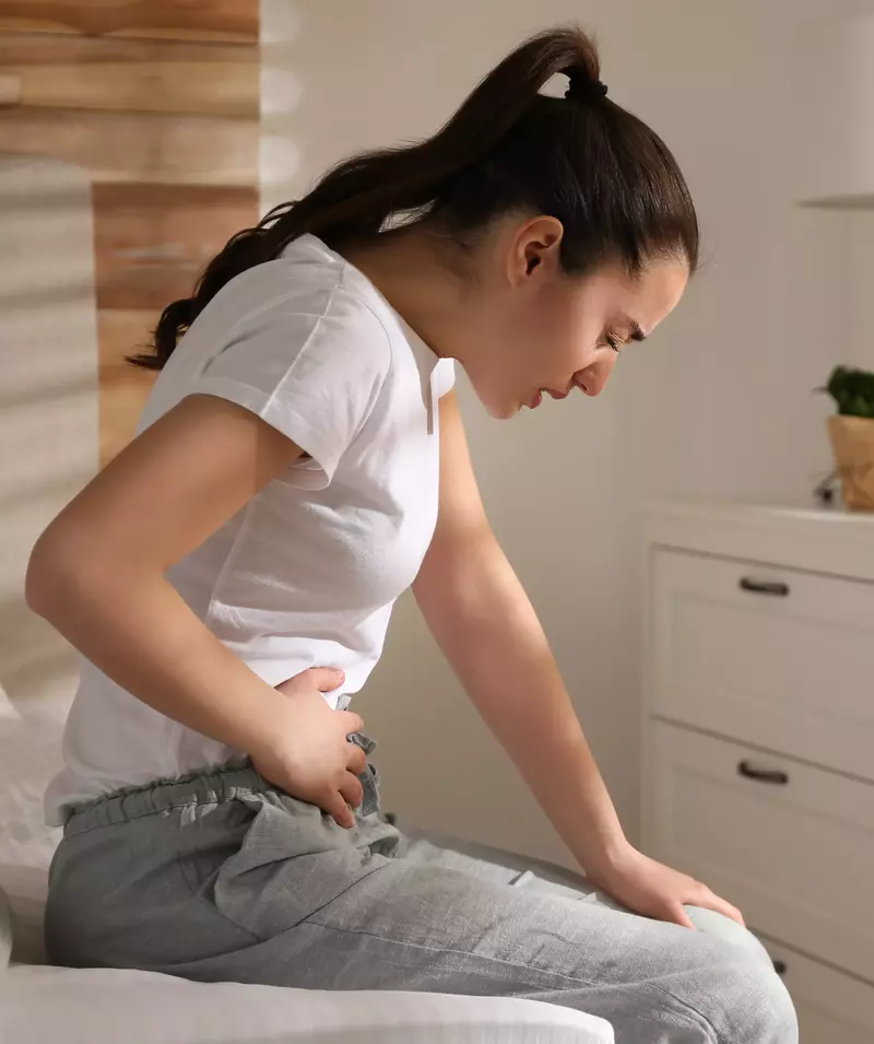 woman holding stomach