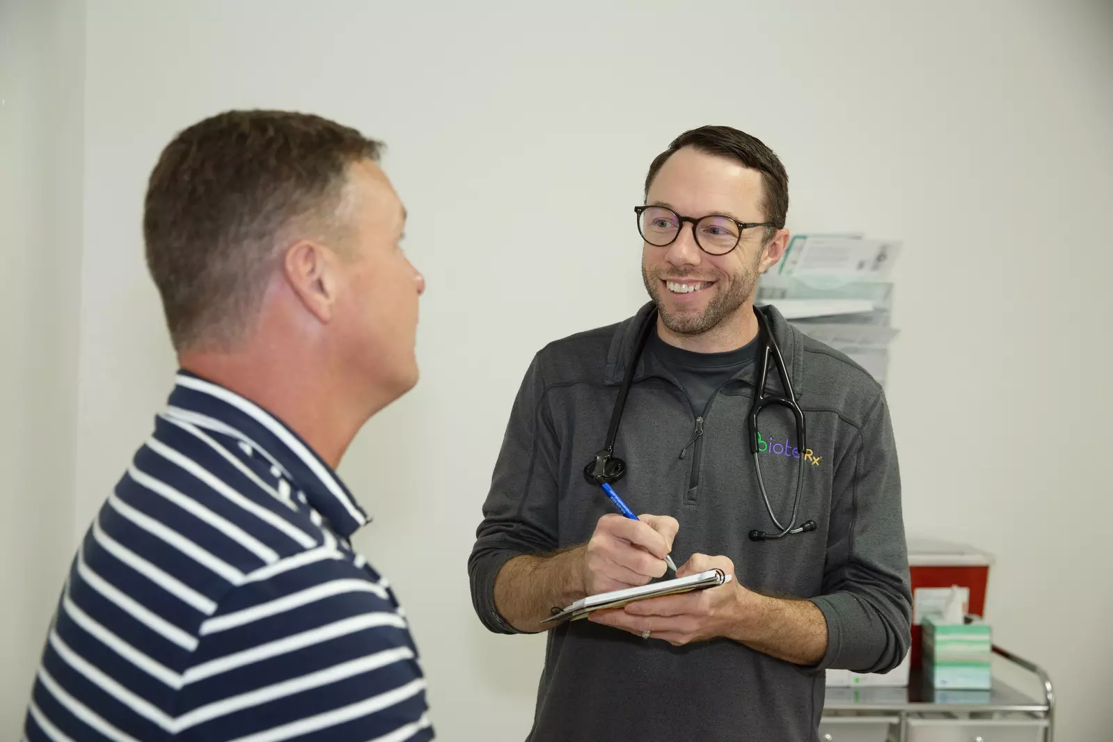 pharmacist at Pristine Health helping a patient