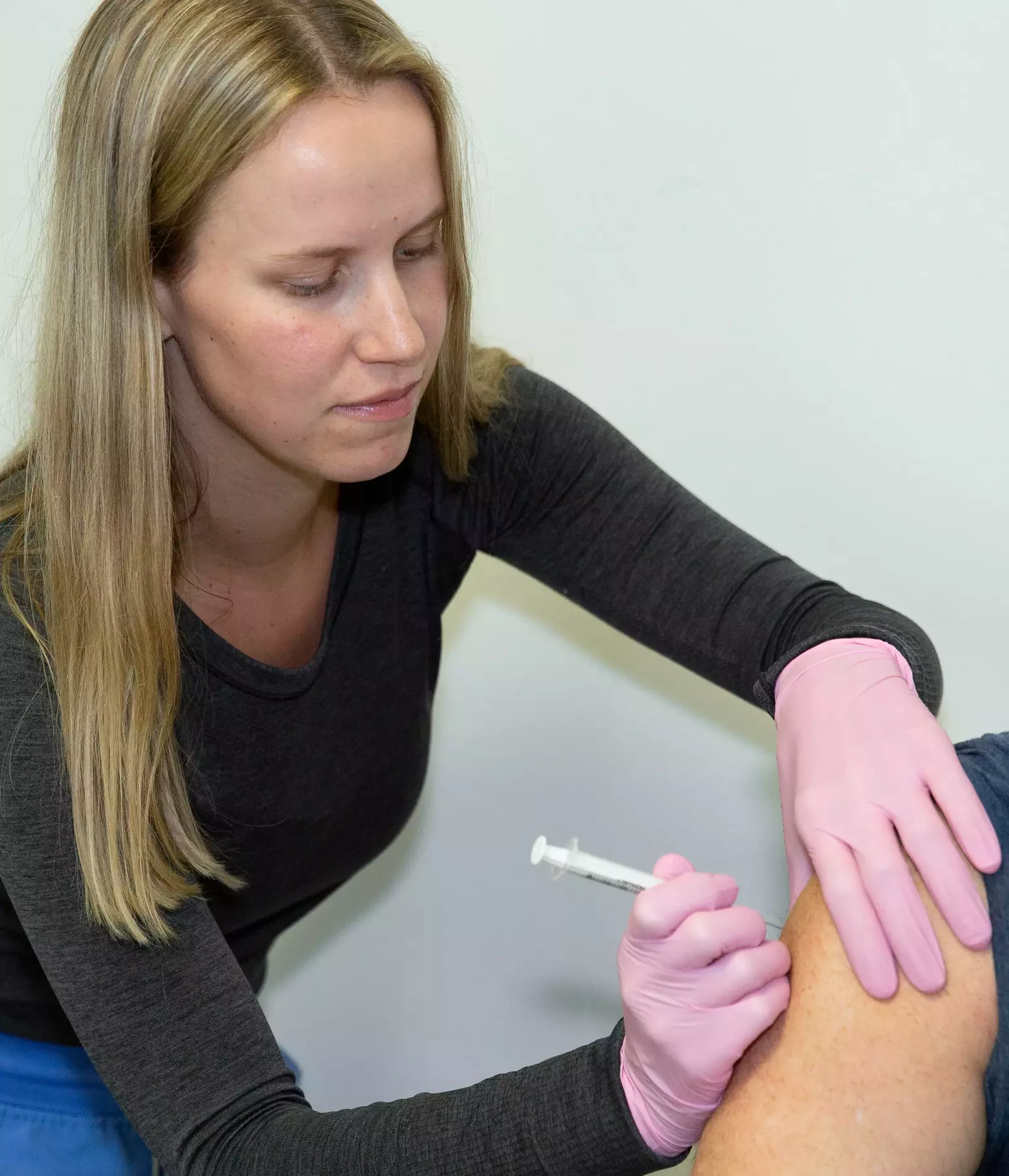 pharmacist giving a vaccination